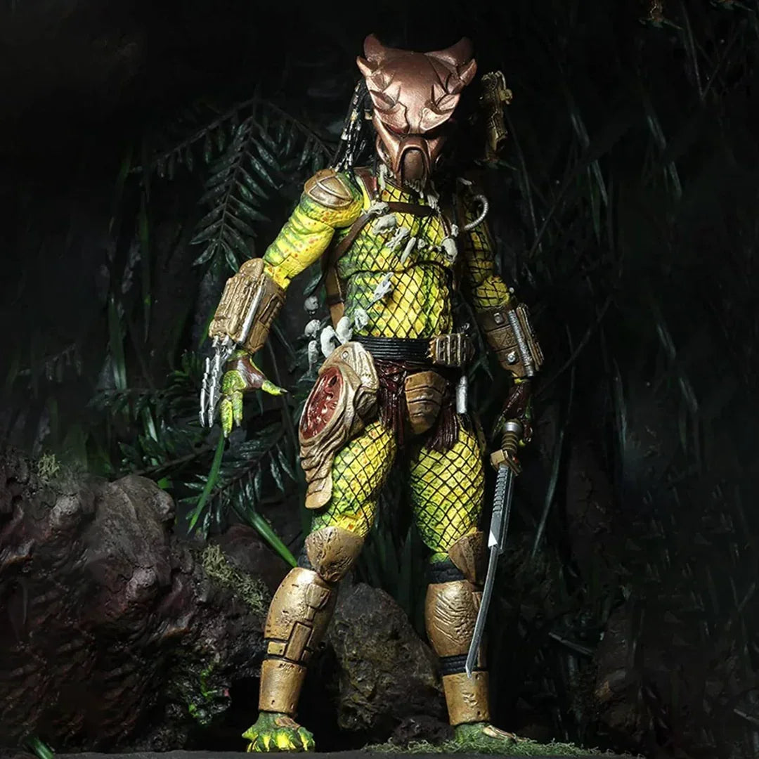 Collectible alien action figure with detailed armor and weapons posed in jungle setting