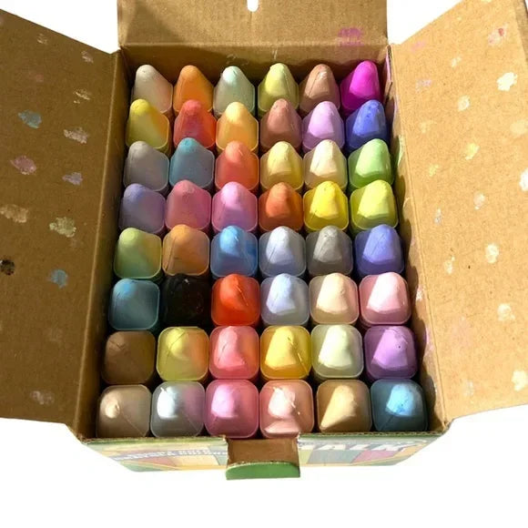 Open box of colorful sidewalk chalk sticks arranged in rows for kids' art and play