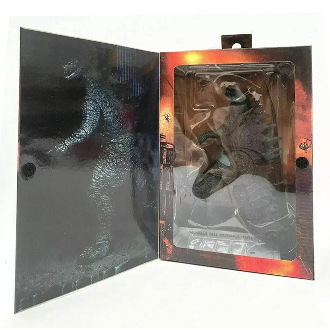 Collectible Godzilla action figure in display box with city background and helicopters