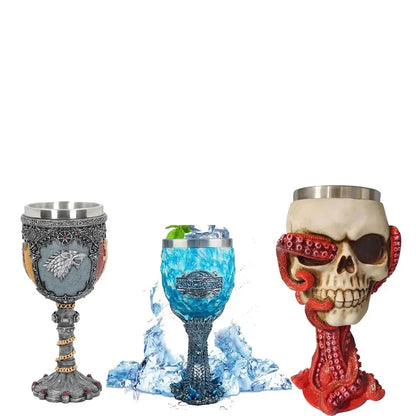 Three fantasy-themed mugs with ornate designs, including a wolf emblem, blue dragon motif, and skull with tentacles.