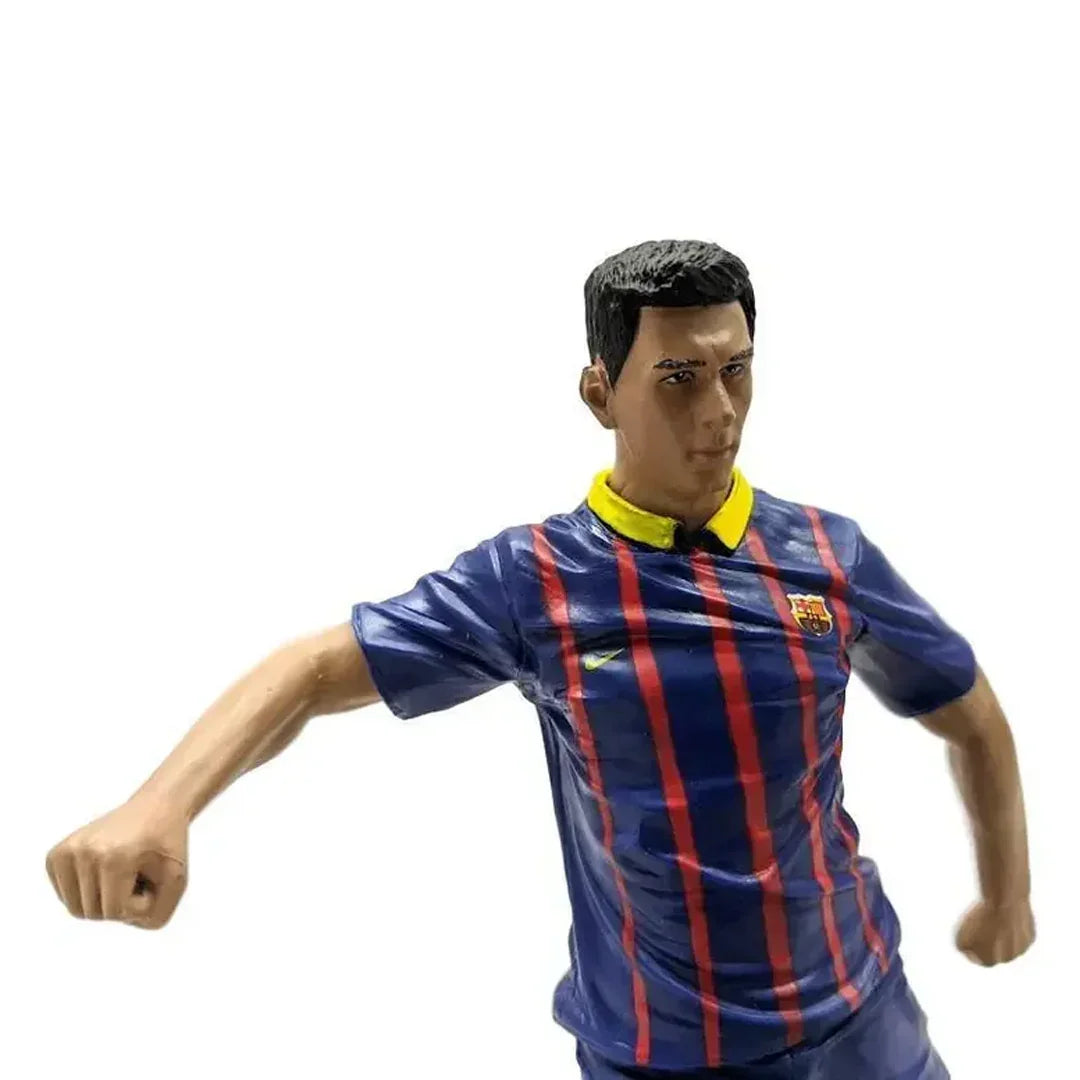 Soccer action figure in blue and red striped jersey with yellow collar and club crest.