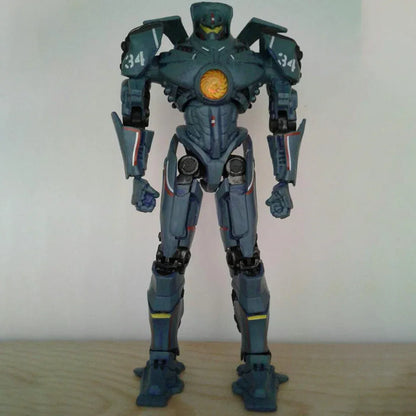 Collectible action figure of a blue robot mech with yellow and orange chest detail on wooden surface
