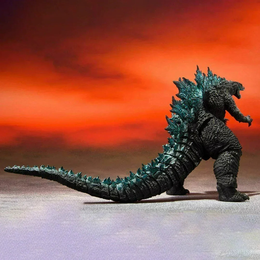Godzilla action figure collectible toy with detailed scales and spikes against a red background