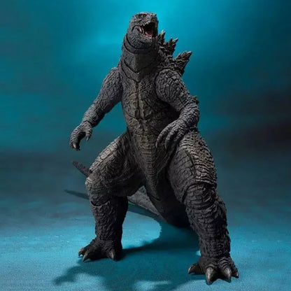 Detailed Godzilla action figure collectible toy with textured scales on blue background