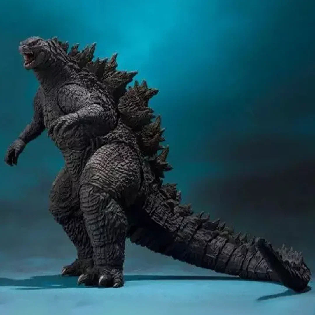 Godzilla action figure collectible toy with detailed scales and dorsal spines on blue background