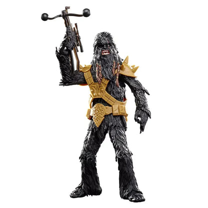 Black furry action figure with gold armor and weapon, collectible toy on white background