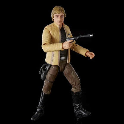 Action figure of a blond male character in yellow jacket, brown pants, holding a blaster toy