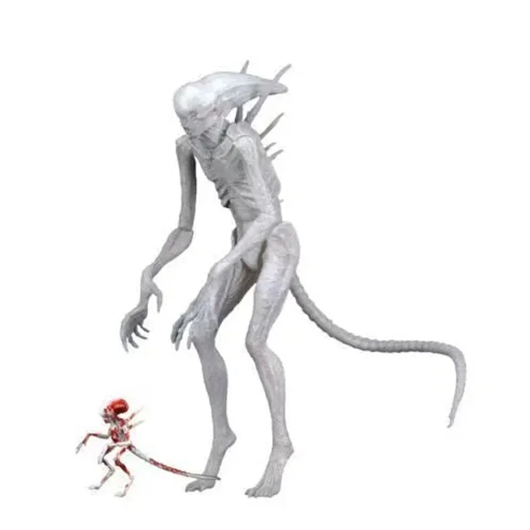 Two articulated alien action figures, one large white creature and one small red alien, on white background.